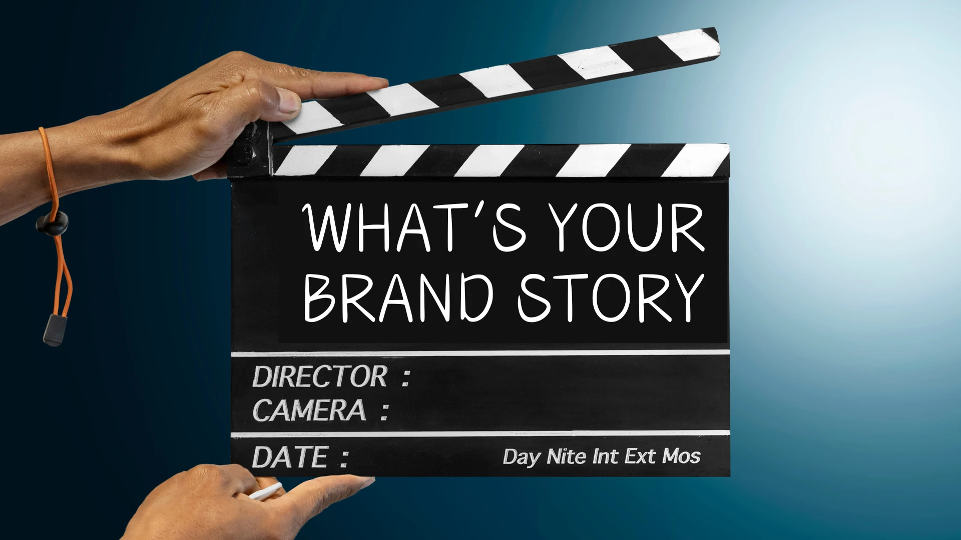 Film clapperboard with the text 'What's Your Brand Story,' symbolizing the use of storytelling frameworks for emotional marketing to engage audiences and build brand loyalty.